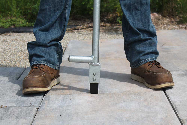 Metal bar with tooth that separates pavers and slabs to straighten the lines while hardscaping