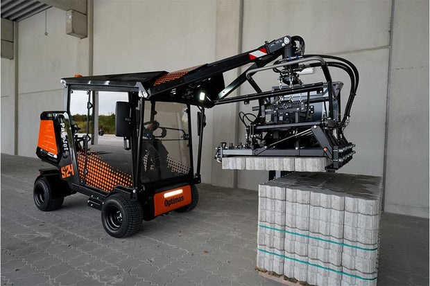 An orange and black S24 PaveJet paver laying machine laying pavers